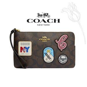 Coach Large Corner Zip Wristlet In Signature Canvas With Ski Patches